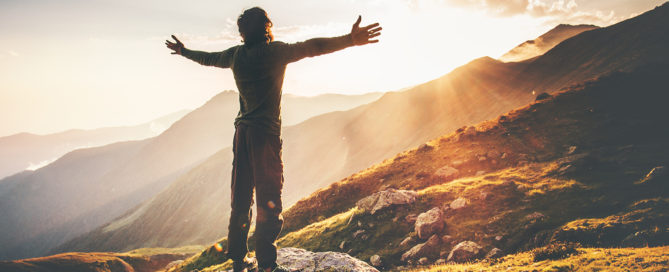 American Outdoor Gear Hub Blog Post Hiker shows joy mountains sunrise
